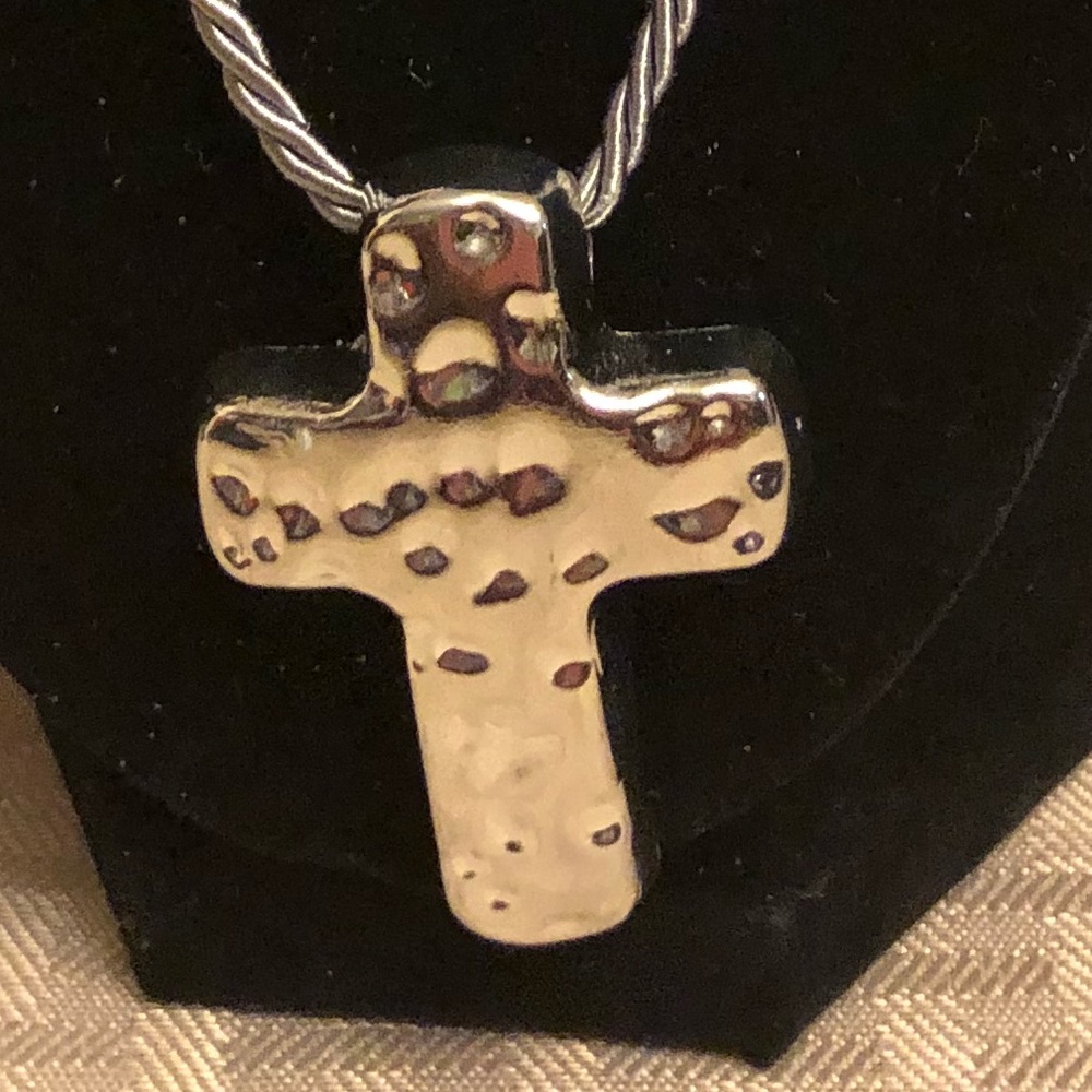 Silver plated cross on a grey cord necklace